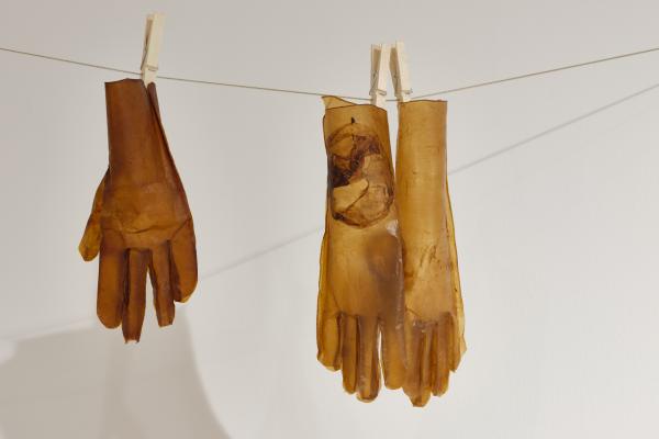 gloves made of cellulose hanging on a laundry-line