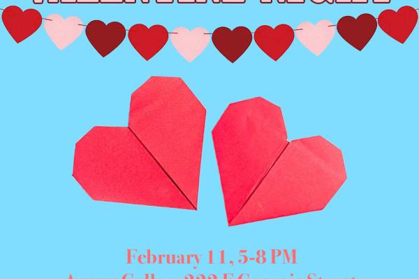 Light blue background with a red and pink paper heart garland across the top, and two origami folded paper hears in the centre of the image. Text reads "Valentine Night" at the top, and event details along the bottom, followed by "Create for someone you care about"