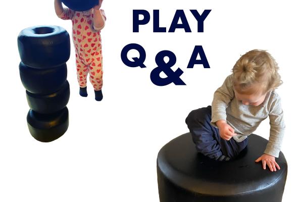 image of a toddler playing with a large sculptures of black beads against a white background. Text reads Play Q & A