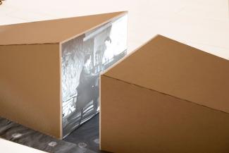 two projection screens boxed in cardboard facing each other