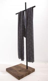 a silk stole hanging on crossed metal rods