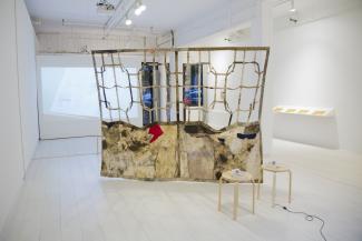 installation view of video projection and textile sculpture