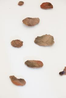 multiple sculptural objects on a white background