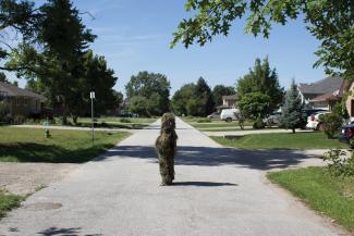 Un-camouflaging #12 (Forms of Awareness: Ghillie Suit). Performance, Windsor, ON Photo: Bree Arbor. 2012. Courtesy of the Artist.