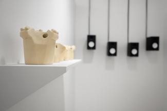 Installation views of sculptural objects in a gallery