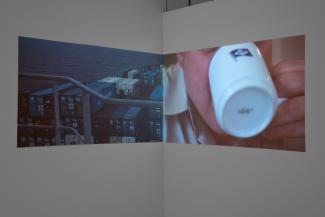 Installation views of video installed in a corner of a gallery
