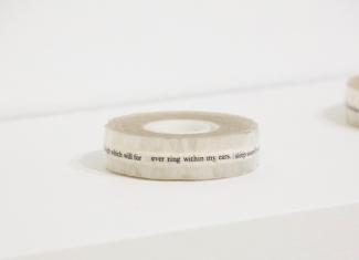 a circular object on a white shelf