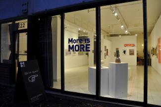 view from the outside into the gallery at night