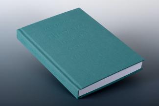 A book with a teal linen cover, embossed with the words "They are lost as soon as they are made"