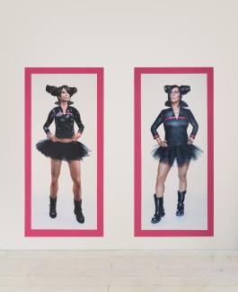 Two side-by-side portraits of figures in matching outfits, featuring a black tutu, matching top, and boots, against a white background with magenta borders.
